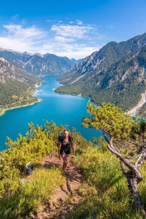 Hiker walking at Plansee