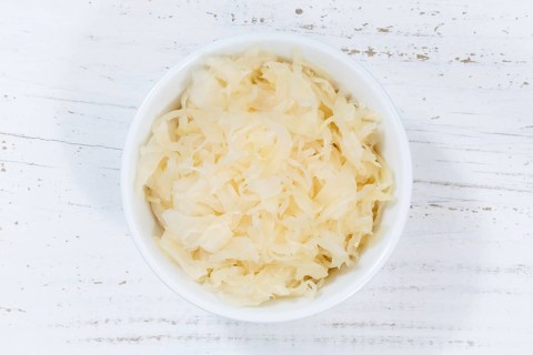 Sauerkraut white cabbage cabbage cut from top wooden board