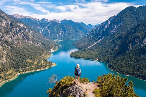 Hiker looking at Plansee