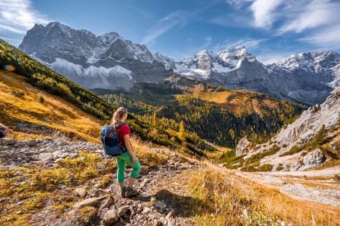 Hiker on hiking trail in the mountains