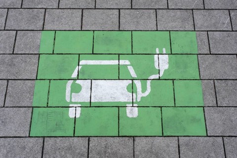 Parking and charging station for electric vehicle