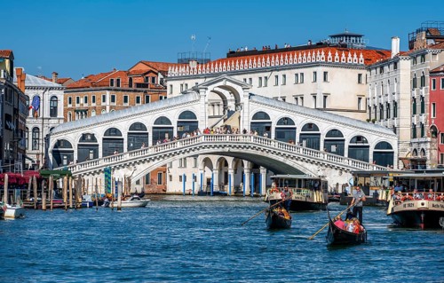 Gondola with tourists on the Grand Canal