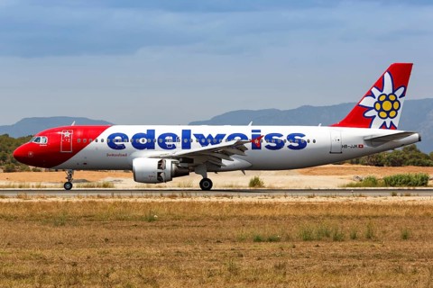 An Edelweiss Airbus A320 with registration HB-JJK lands at Palma de Majorca Airport