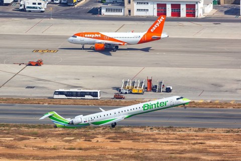 A Bombardier CRJ-1000 aircraft of Binter with registration 9H-MOX takes off from Palma de Majorca Airport
