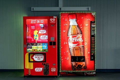 Vending machines for Langnese ice cream and Coca-Cola soft drinks in a waiting room
