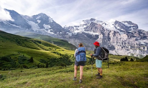 Two hikers in front of the Eiger north face
