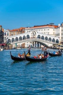 Gondola with tourists on the Grand Canal