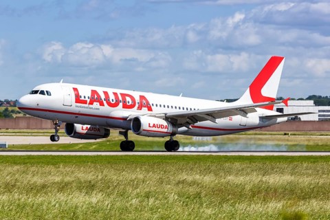 A Lauda Airbus A320 aircraft with registration number OE-LOY lands at Stuttgart Airport