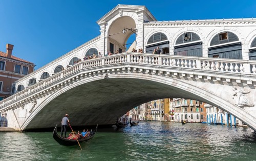 Gondola with tourists on the Grand Canal