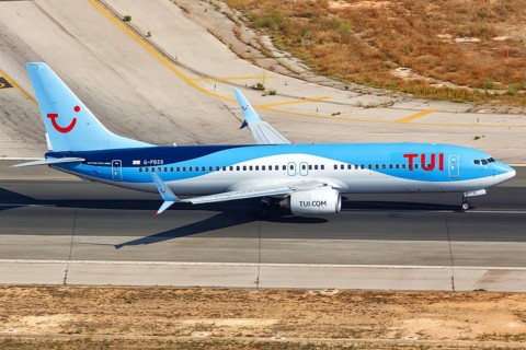 A TUI Boeing B737-800 with the registration G-FDZS takes off from the airport in Palma de Majorca