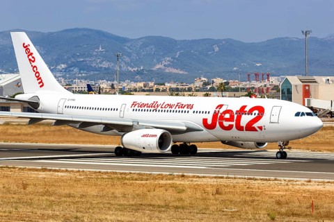 A Jet2 Airbus A330-200 with registration G-VYGL takes off from the airport in Palma de Majorca