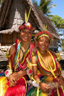 Girl and boy decorated for traditional bamboo dance