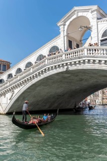 Gondola with tourists on the Grand Canal