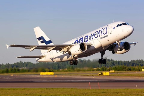 A Finnair Airbus A319 with the registration OH-LVD in the OneWorld special livery takes off from Helsinki Airport