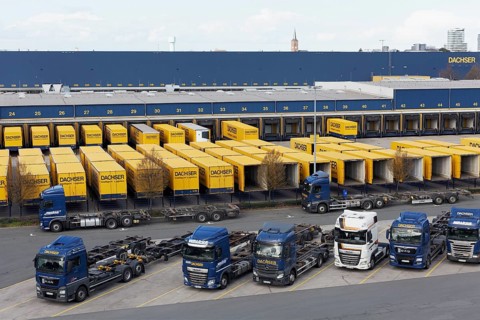 Parking lot with articulated lorry and semi-trailer
