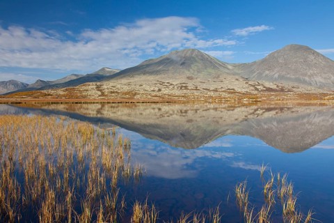 Stygghoin reflected in the water of the lake in autumn
