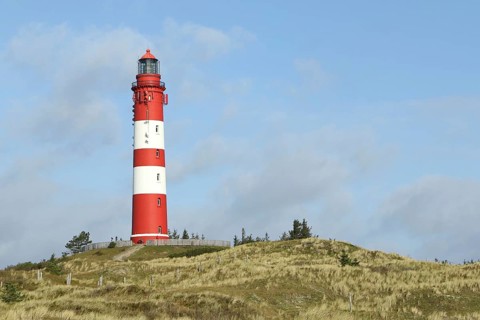 Lighthouse in dune landscape