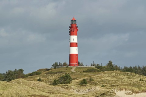 Lighthouse in dune landscape