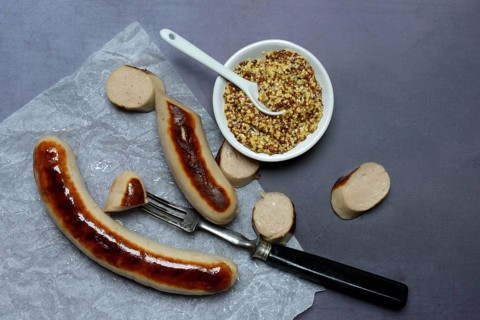 Sliced bratwurst and skin with Dijon mustard