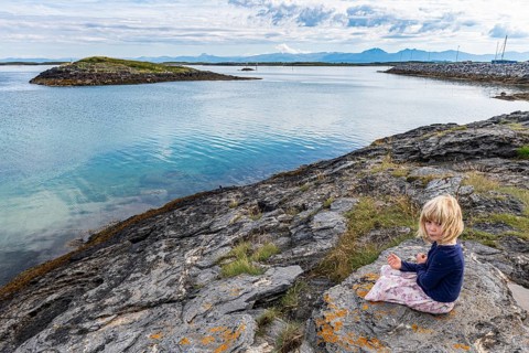 Little girl on a rock