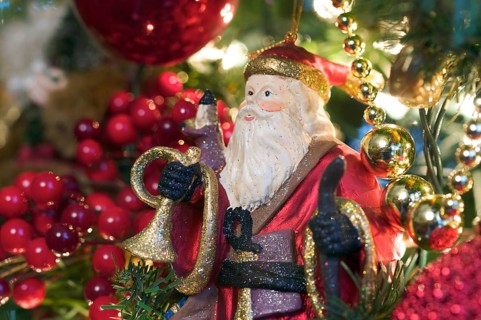Santa ornament hanging on the christmas tree