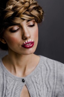 Young woman with flower lips