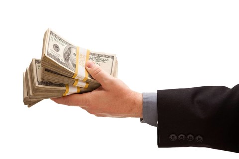 Man handing over hundreds of dollars isolated on a white background