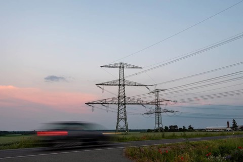 Car driving in the evening twilight
