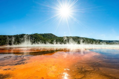 Steaming hot spring with sun star