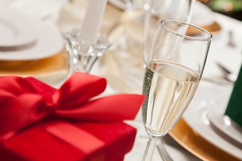 Beautiful christmas gift with place setting abstract at table