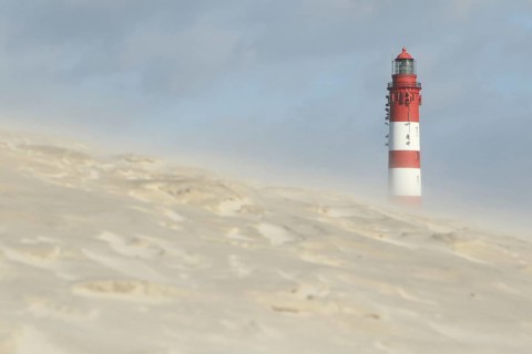 Lighthouse in dune landscape