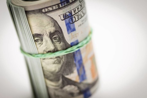 Abstract roll of newly designed U.S. one hundred dollar bills