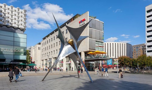 Pedestrian zone Prager Strasse with sculpture Voelkerfreundschaft and round cinema