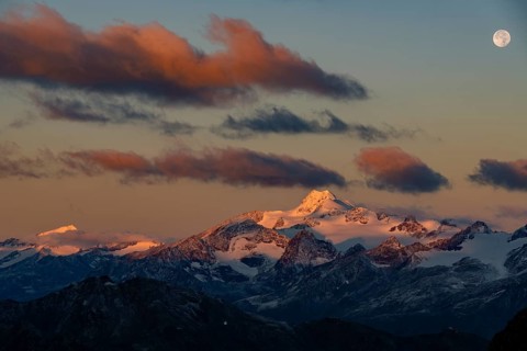 Full moon over summit of Oetztaler Wildspitze