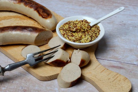 Sliced bratwurst and skin with Dijon mustard