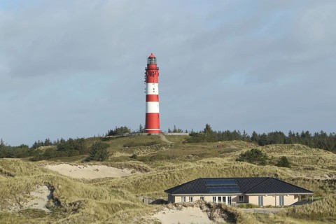 Lighthouse in dune landscape