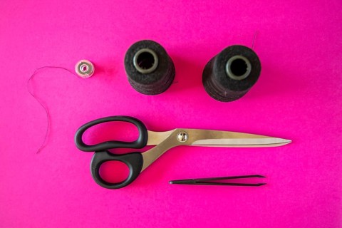 Black tailoring accessories as scissors