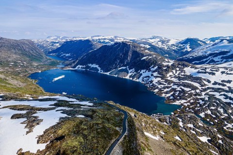 Aerial of a mountain lake in the mountains over Geirangerfjord