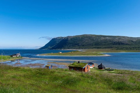 Remote little bay and settlement along the road to the Nordkapp