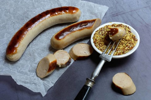 Sliced bratwurst and skin with Dijon mustard