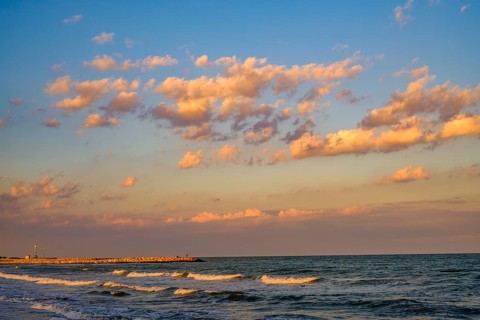The Adriatic Sea with light waves in the evening light