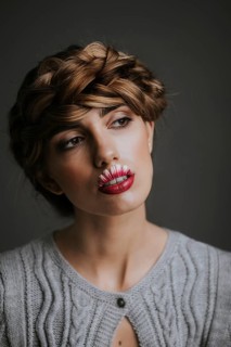 Young woman with flower lips