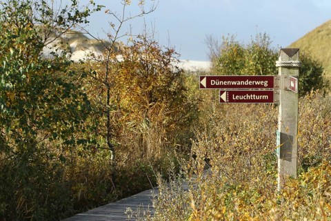 Signpost at the wooden plank path at Kniepsand
