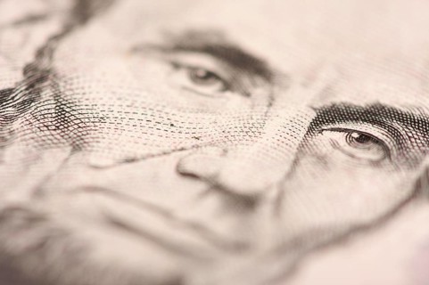 Abstract macro of U.S. five dollar bill's abraham lincoln face with narrow depth of field