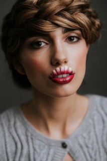 Young woman with flower lips
