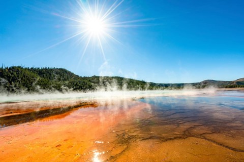 Steaming hot spring with sun star