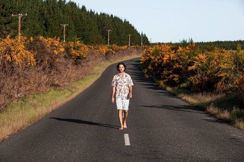Guy walking on a road