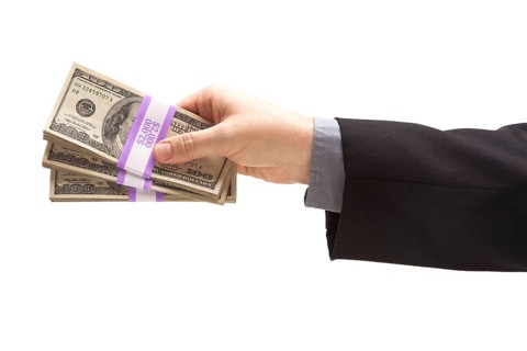 Man handing over hundreds of dollars isolated on a white background
