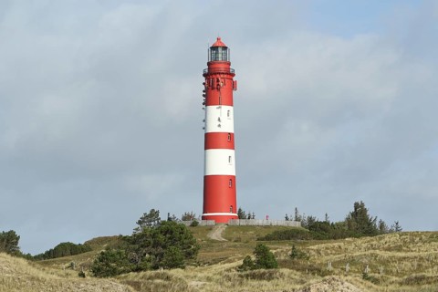 Lighthouse in dune landscape