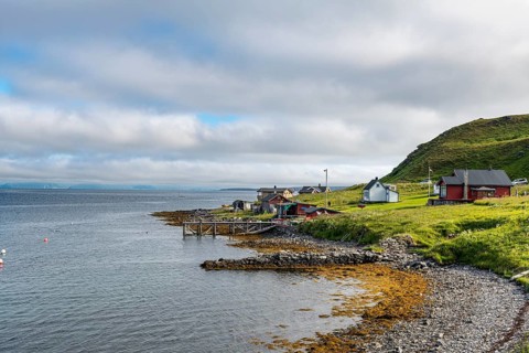 Remote little bay and settlement along the road to the Nordkapp
